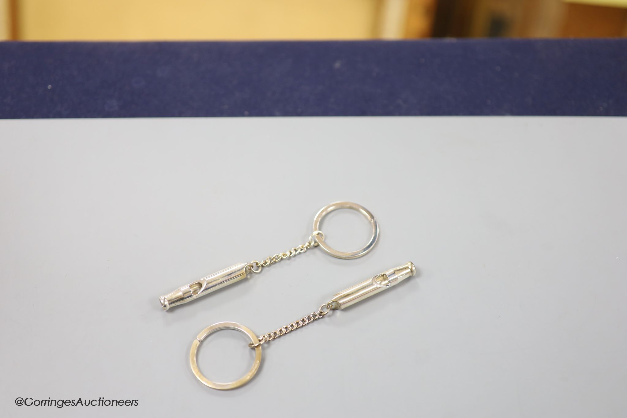 Two boxed modern silver Master of Craftmanship sterling 915 whistle key chains.